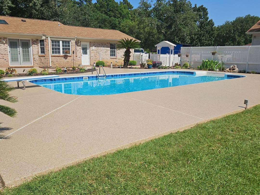 After: wide view of a finished flake-coated pool deck