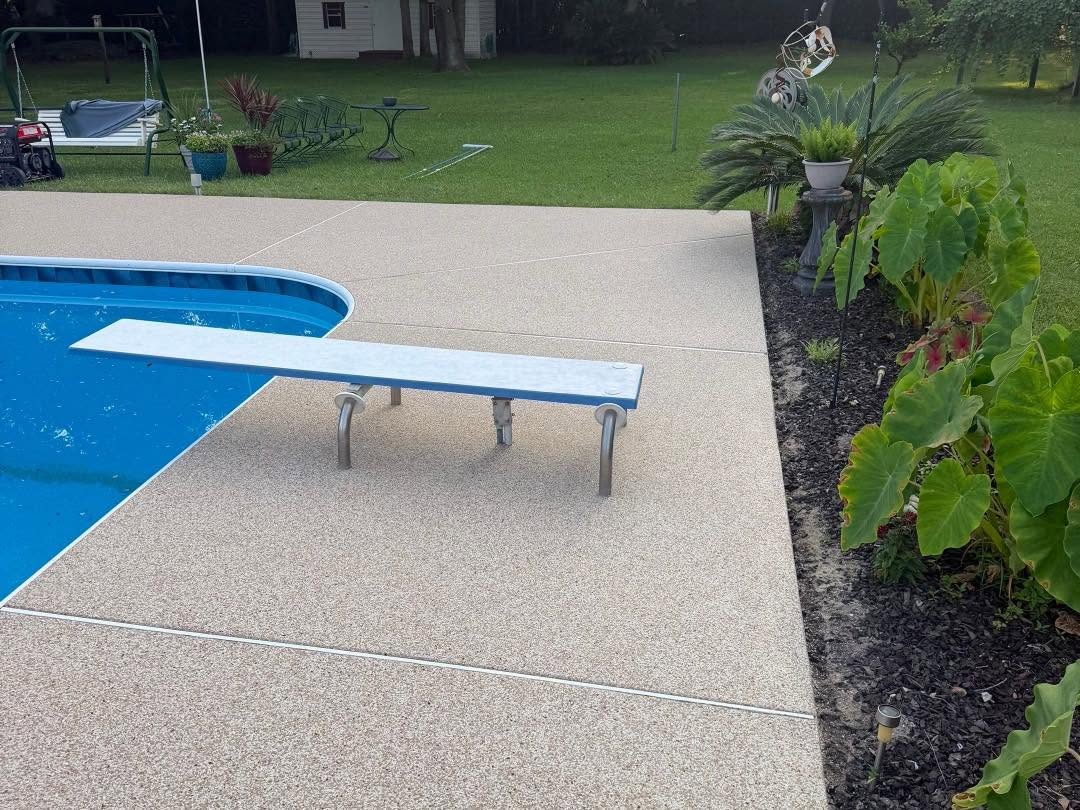 After: light flake-coated pool deck looking toward the backyard
