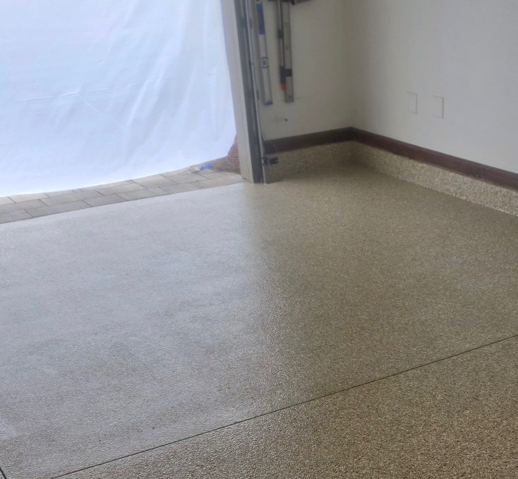 After: gray flake garage floor coating