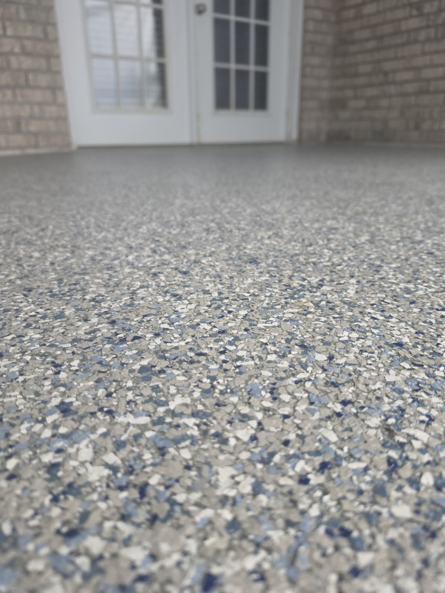 Close-up of blue-gray flake texture on a patio