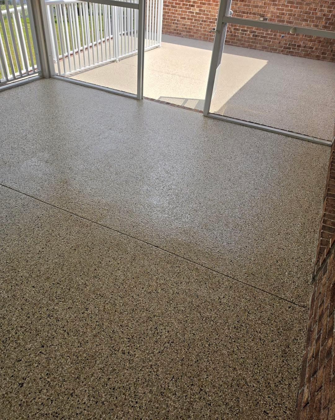After: seamless flake coating on the same sunroom floor