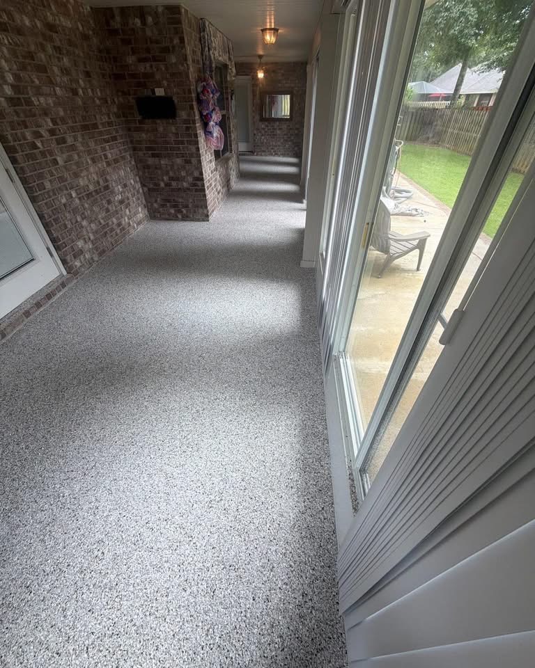 After: gray flake coating on the same back patio